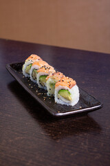 SALMON ROLL, Avocado filling with cream cheese and tenkatsu with salmon foil.