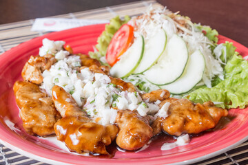 CHICKEN NANBAN, Fried chicken bathed in sweet and sour sauce accompanied with tartar sauce.