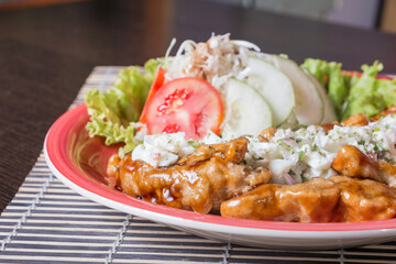 CHICKEN NANBAN, Fried chicken bathed in sweet and sour sauce accompanied with tartar sauce.