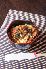 KATSU DON, Pork breaded with panko, stewed with onion, egg on rice.