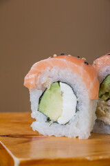 SALMON ROLL, Avocado filling with cream cheese and tenkatsu with salmon foil.