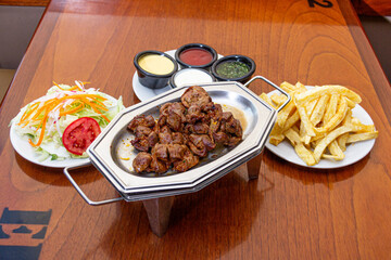 fried sweetbreads, served with potatoes and salad