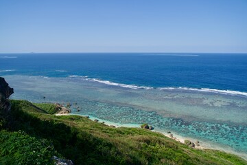 Fototapeta na wymiar Peninsula cliffs and seascape seen from HigaRoad Park in Miyakojima