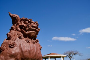 Statue of Shisa and blue sky scenery