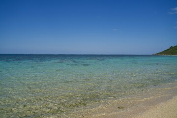 Fototapeta na wymiar Aragusuku Beach where the waves are so calm that the sea is crystal clear