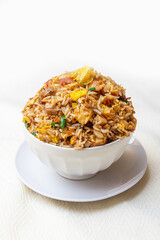 Combination of Peruvian style chaufa, chicken, pork and vegetables