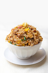 Combination of Peruvian style chaufa, chicken, pork and vegetables