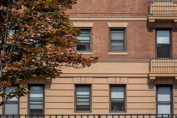 old brick building and fall leaves