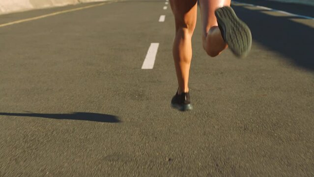 Fitness, freedom and health, a woman running a city road. Sports, exercise and motivation, a strong runner training for a marathon or race. Cardio, strength and sweat, healthy girl on street workout.