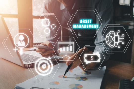Asset management Business technology internet concept, Businessman analyzing financial data on office desk with virtual screen asset management icon.