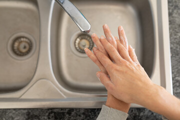 Caucasian woman spending time at home self isolating and social distancing in quarantine lockdown du