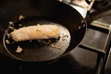 Fotobehang Chef cooking a fish © WavebreakMediaMicro