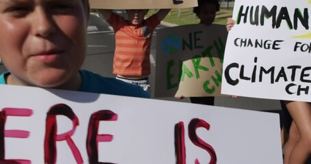 Group of kids with climate change signs in a protest