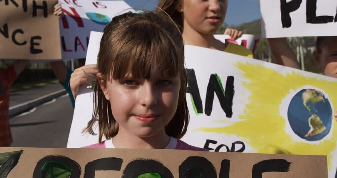 Girl with climate change sign in a protest