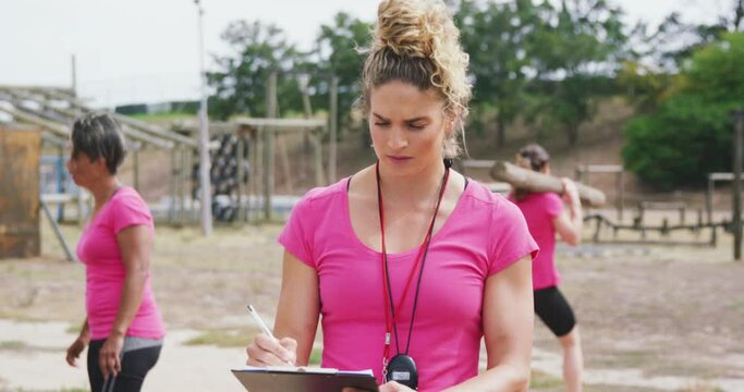 Female coach standing at bootcamp