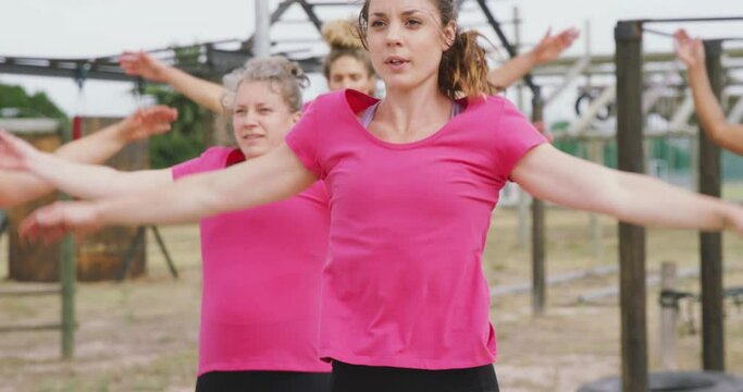 Female friends enjoying exercising at boot camp together