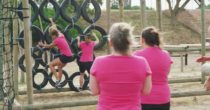 Female friends enjoying exercising at boot camp together