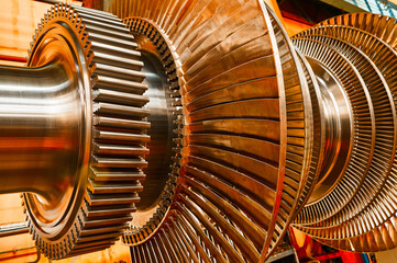 Rotor of modern steam turbine in plant workshop closeup