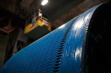 Fragment of a large rotor of a powerful electric motor, extremely close view. The rotor is painted...