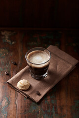 Coffee with milk on dark wooden background. Close up.	