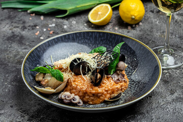 Risotto with seafood shrimp and mussels in shells. Mediterranean cuisine. Restaurant menu, dieting, cookbook recipe top view.