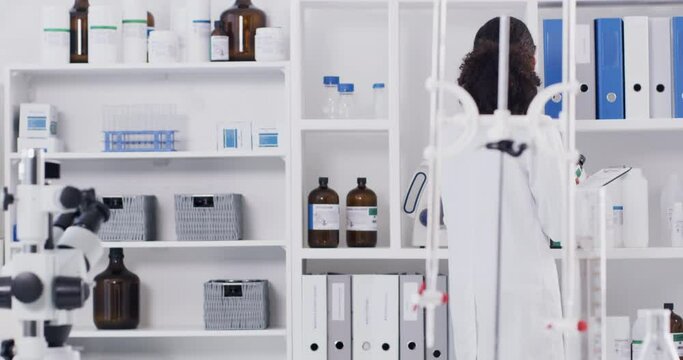 Medical scientist in research laboratory, stock inventory and black woman in science. Pathology healthcare expert working, knowledge of pharmaceutical medicine bottle and professional career person