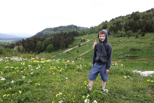 Child on alpine meadow of Lago-Naki plateau