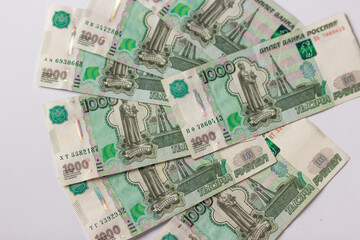 Russian money, banknote face value of one thousand rubles. Fall and devaluation of the russian ruble, crisis.