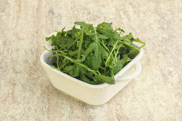 Fresh green arugula in the bowl