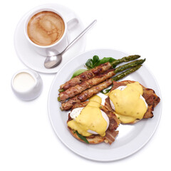Healthy food - Asparagus wrapped with bacon and benedict poached eggs on a plate isolated on white background