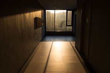 Silhouette office with sunset light leak by window