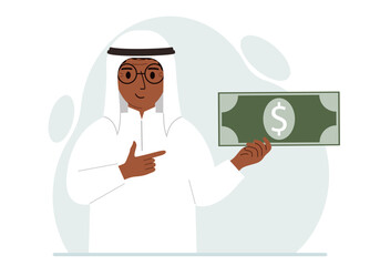 A arab man holds a large paper bill in his hand. The concept of income, expense, earning or spending money.