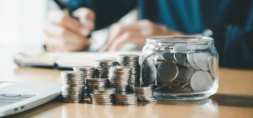Man hands putting coins stack, Concept business finance saving money and investment.