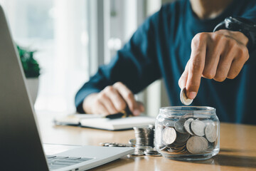 Man hands putting coins stack, Concept business finance saving money and investment.