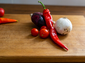 red and white onions on a wooden cutting board