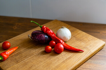 red and white onions on a wooden cutting board