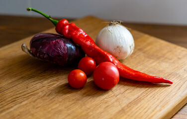 red and white onions on a wooden cutting board
