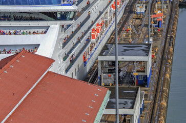 Transit passage through locks of famous Panama Canal on cruiseship cruise ship liner with panoramic view of landscape, waterways and other vessels	