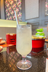 Cold lemon juice in clear glass ready to drink for freshness.