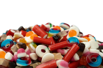 Tasty mix of jelly colorful candies isolated on a white background.