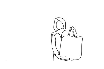 a young woman is shopping with a healthy eco-friendly fabric handmade ecological bag and holding and showing her shopping bag