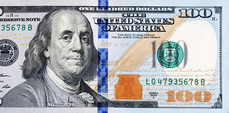 Macro shot of a new 100 dollar bill. A detailed picture of US money for financial, economic and business news publications.