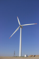 Fototapeta premium Wind turbine power is a clean, renewable source of energy that has become increasingly popular in recent years.