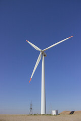 Fototapeta premium Wind turbine power is a clean, renewable source of energy that has become increasingly popular in recent years.