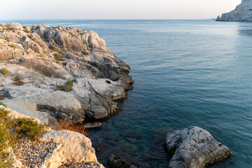 Fisherman on the rocky coast of the sea