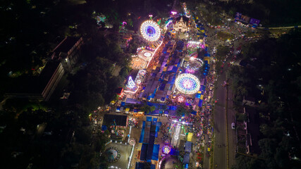Aerial view of Giant Wheels at Indian fair, Ferris wheel in mela, drone view