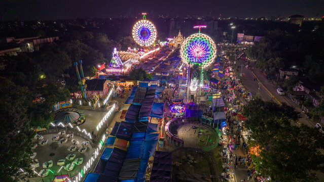 Aerial view of Giant Wheels at Indian fair, Ferris wheel in mela, drone view