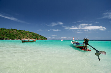 Vacation in paradise. Travel by Thailand. Beautiful landscape with white sand tropical beach and turquoise water.