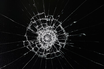 Naklejka na ściany i meble cracks on the glass impact on the glass, abstract background broken window damage