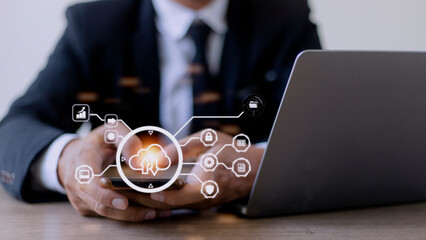 man use Laptop with cloud computing diagram show on hand. Cloud technology. Data storage. Networking and internet service concept.